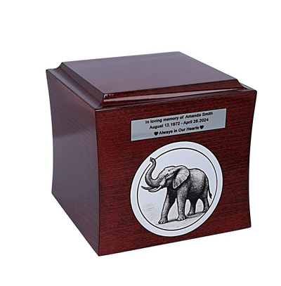 Wooden urn with engraved elephant graphic